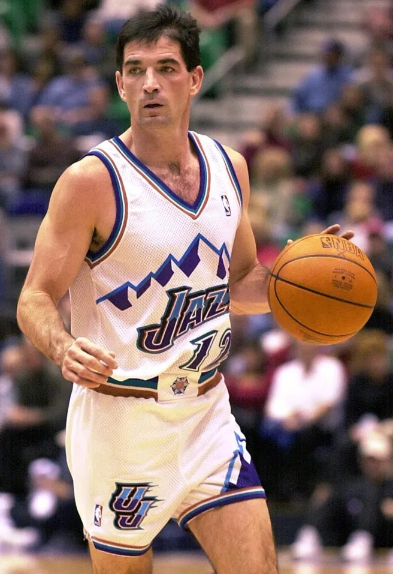 when did basketball players start wearing long shorts1