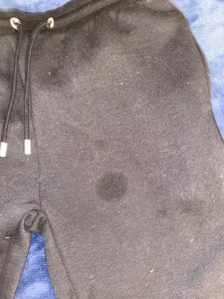 Anyone know how to get this stain off black sweatpants Washed once already CleaningTips